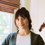 Alicia sitting in a bright room